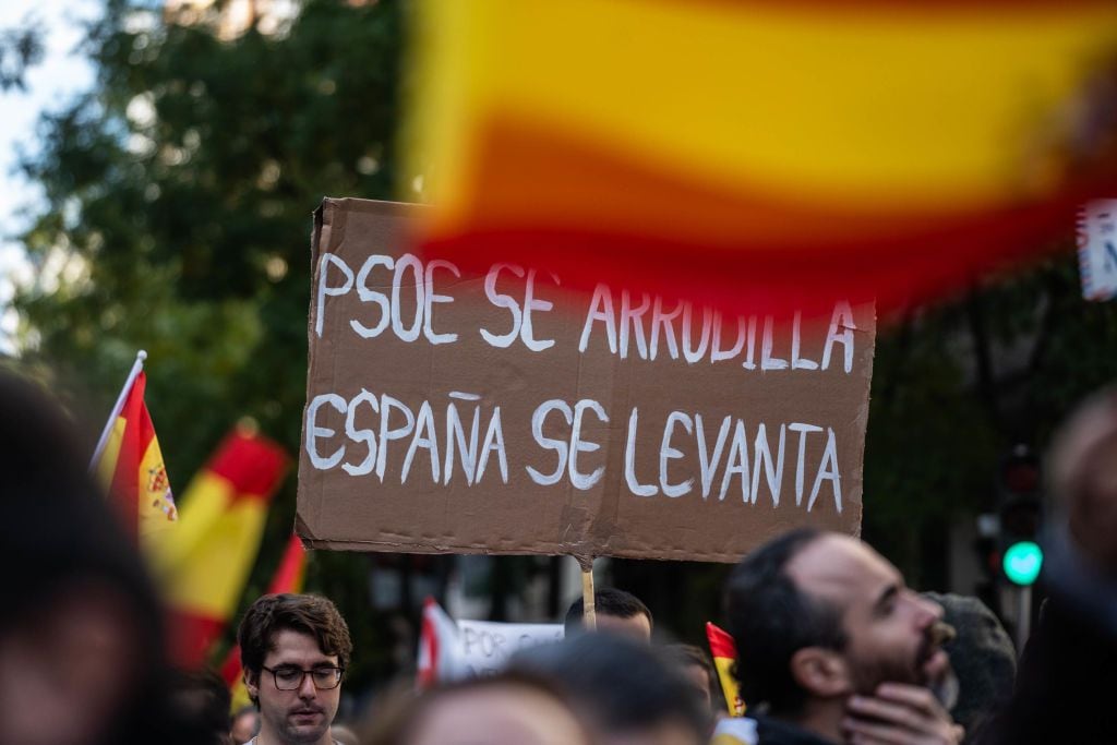 MADRID, SPAIN - NOVEMBER 12: Hundreds of people during a demonstration against the amnesty, in front of the PSOE headquarters, on 12 November, 2023 in Madrid, Spain. Convened by the PP, a rally is held in Madrid following the pact between the PSOE and Junts that has taken place in Brussels to invest the acting Prime Minister and socialist candidate for re-election, Pedro Sanchez. The pact includes a possible amnesty law. (Photo By Matias Chiofalo/Europa Press via Getty Images)