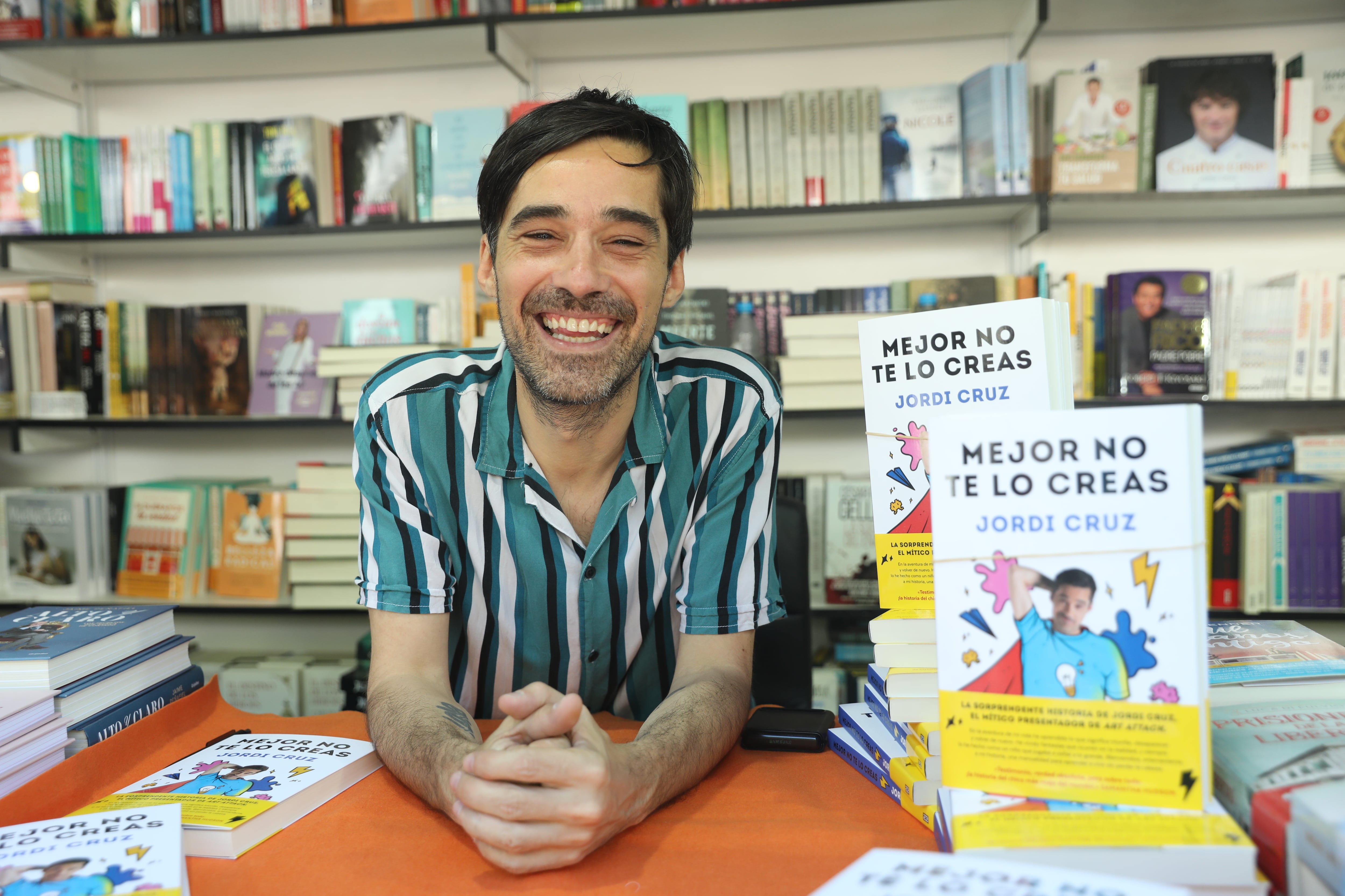 Presenter and communicator Jordi Cruz signs his book &#039;Mejor no te lo creas&#039; at the 2022 Book Fair, at El Retiro Park, on May 28, 2022, in Madrid, Spain.