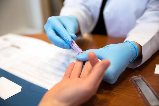 Doctor tests a patient for HIV AIDS.