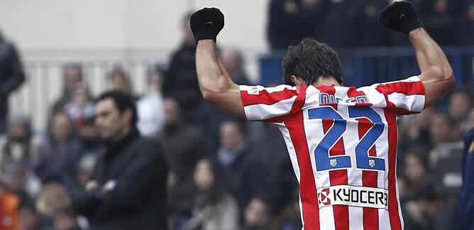 El centrocampista brasileño del Atlético de Madrid Diego Ribas celebra el tercer gol de su equipo durante el encuentro