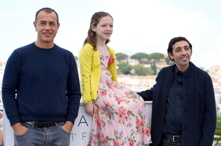 Director Matteo Garrone, actress Alida Baldari Calabria and Marcello Fonte attend &quot;Dogman&quot; Photocall during the 71st annual Cannes Film Festival at Palais des Festivals on May 17, 2018 in Cannes, France