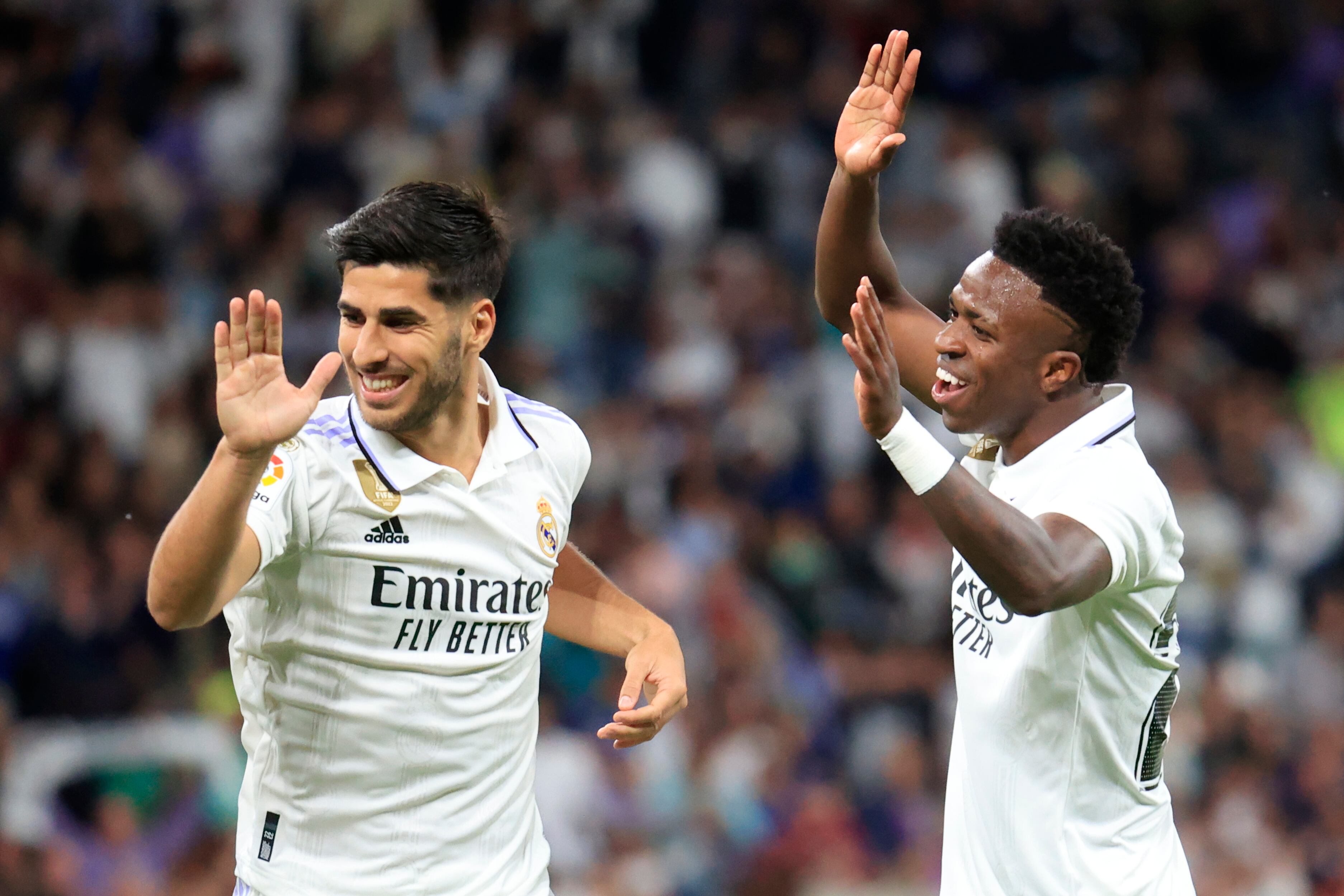 Marco Asensio celebra su gol anrte el Getafe con Vinicius Junior