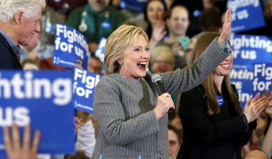 U.S. Democratic presidential candidate Hillary Clinton waves to supporters as she stands on stage with former U.S. President Bill Clinton and daughter Chelsea Clinton during a campaign rally at Abraham Lincoln High School in Des Moines, Iowa January 31, 2