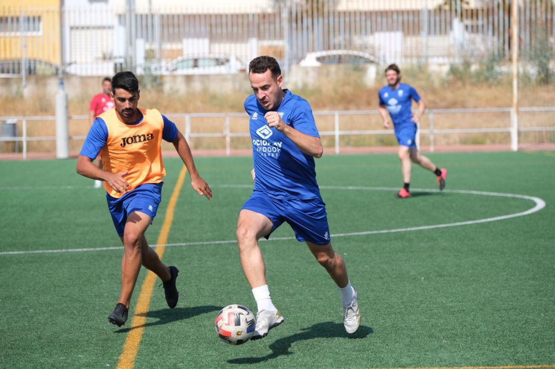 Juanca junto a Adri en un entrenamiento en La Granja 