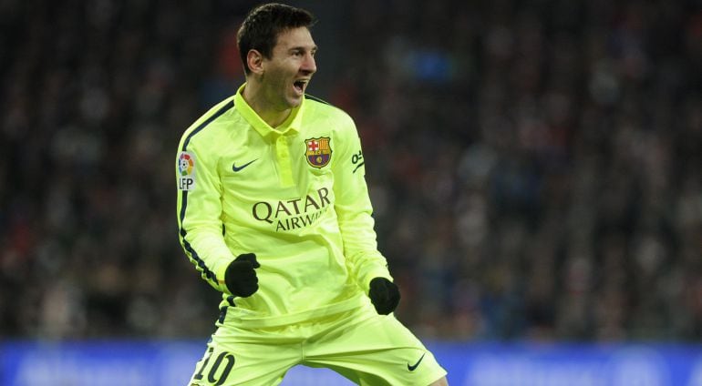 Barcelona's Argentinian forward Lionel Messi celebrates after scoring during the Spanish league football match Athletic Club Bilbao vs FC Barcelona at the San Mames stadium in Bilbao on February 8, 2015. Barcelona won 5-2.    AFP PHOTO/ ANDER GILLENEA