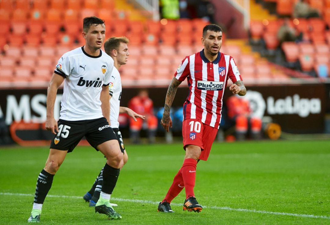 Hugo Guillamon of Valencia CF and Angel Correa of Atletico de Madrid  during the La Liga Santander mach between Valencia and Atletico de Madrid at Estadio de Mestalla on November 28, 2020 in Valencia, Spain