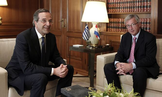 El primer ministro de Grecia, Andonis Samaras y el presidente del Eurogrupo, Jean Claude Juncker