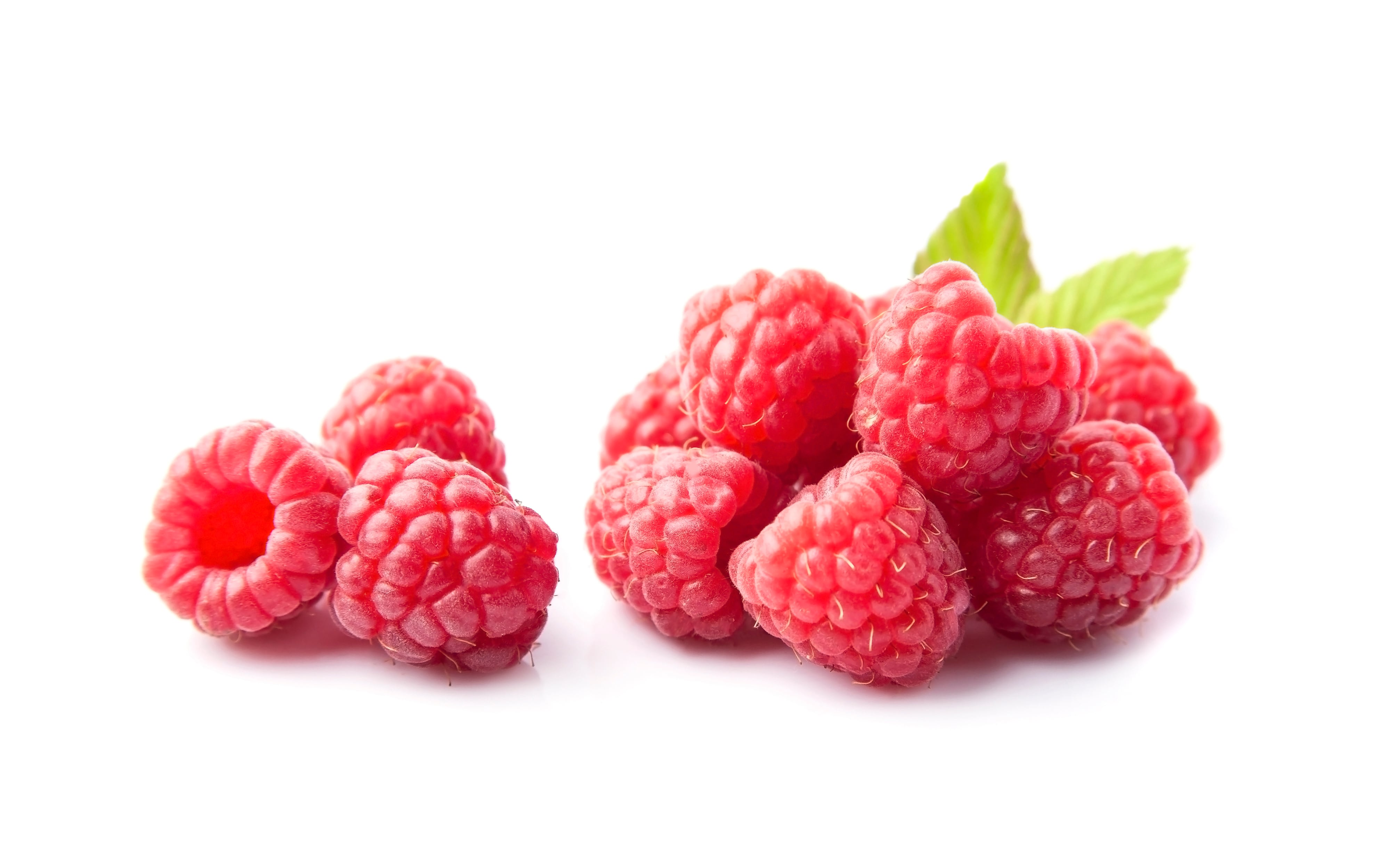 Sweet raspberry with leaves on white backgrounds.