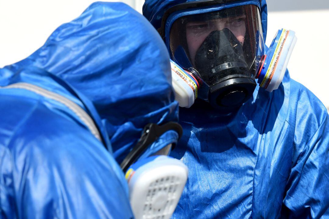 Two Russian soldiers prepare to sanitize the exterior of the Carlo Giovanni Rota retirement home for the elderly in Almenno San Salvatore on April 2, 2020 in Bergamo, Italy. The government of the Russian Federation has sent medical equipment, mobile laboratories and disinfection units, doctors and even military experts in a bacteriological warfare to help the Italian military in the areas most affected by the coronavirus outbreak. The Italian government continues to enforce the nationwide lockdown measures to control the spread of COVID-19.