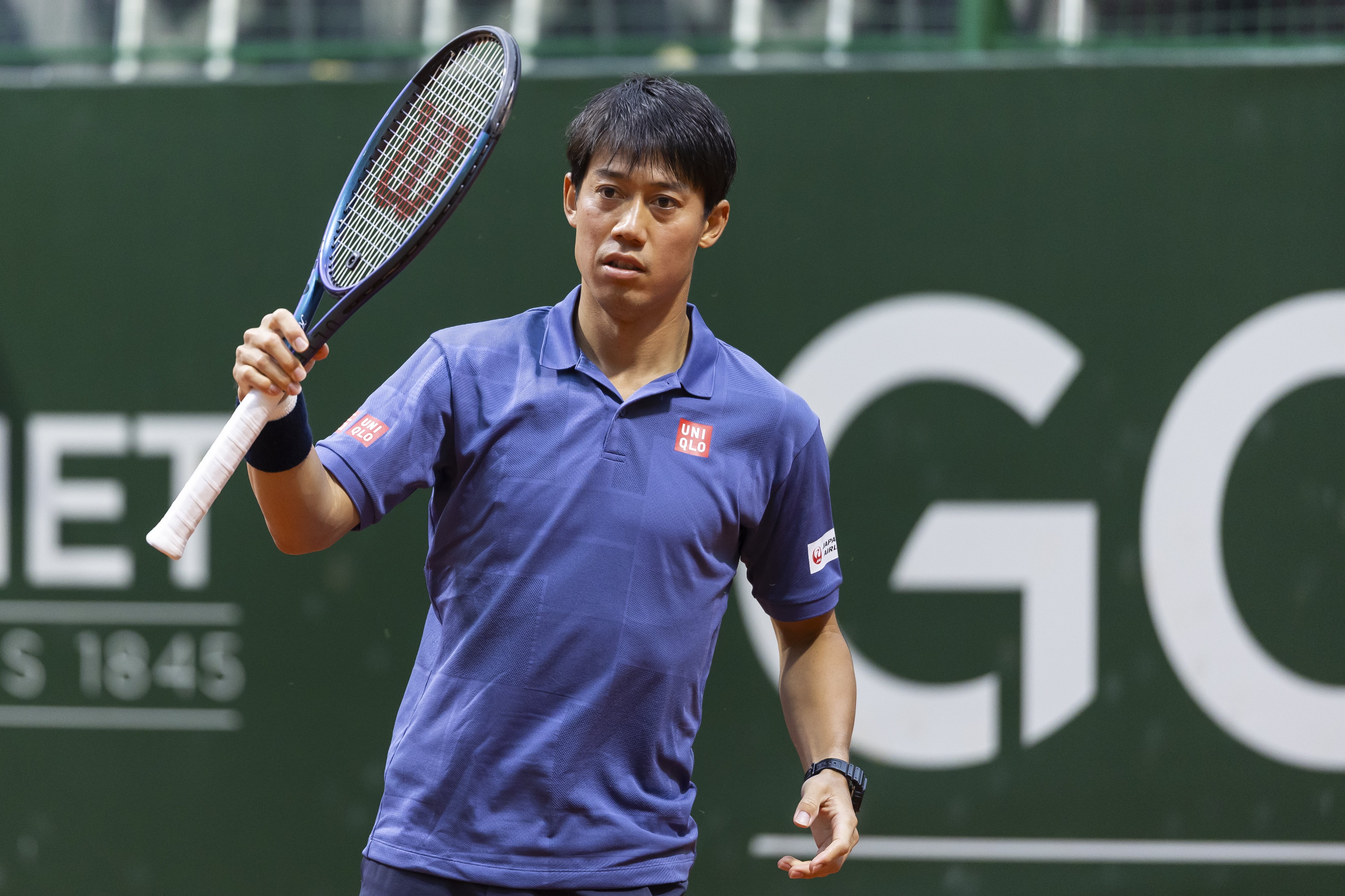 GENEVA (Switzerland), 20/05/2025.- Kei Nishikori of Japan in action against Karen Khachanov of Russia during their round of 16 match at the Geneva Open tennis tournament, in Geneva, Switzerland, 20 May 2025. (Tenis, Japón, Rusia, Suiza, Ginebra) EFE/EPA/CYRIL ZINGARO