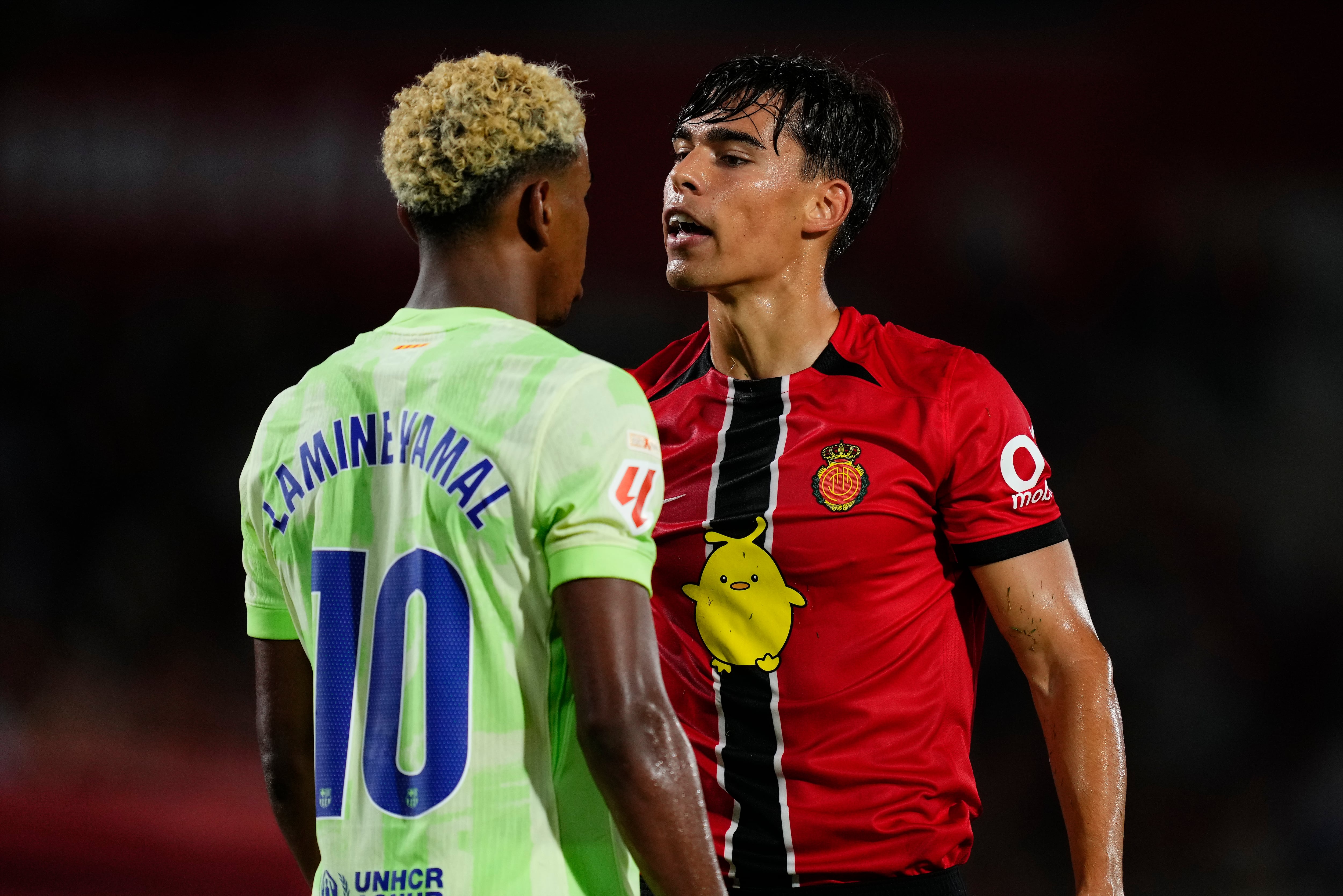 Lamine Yamal right winger of Barcelona and Spain and Jan Salas central midfield of Mallorca and Spain argue during the LaLiga EA Sports match between RCD Mallorca and FC Barcelona at Estadio de Son Moix on August 17, 2025 in Mallorca, Spain. (Photo by Jose Breton/Pics Action/NurPhoto via Getty Images)