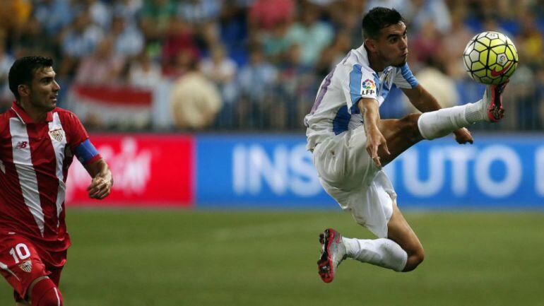 Reyes y Charles, en el partido entre el Málaga y el Sevilla