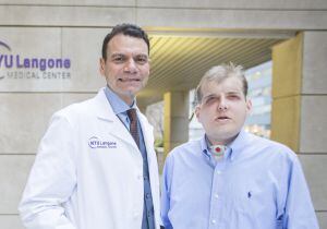 Volunteer firefighter Patrick Hardison, 41, of Senatobia, Mississippi (R) poses with Dr. Eduardo D. Rodriguez who led a team of more than 100 physicians, nurses, technical and support staff, after recovery from face transplant surgery in this undated hand