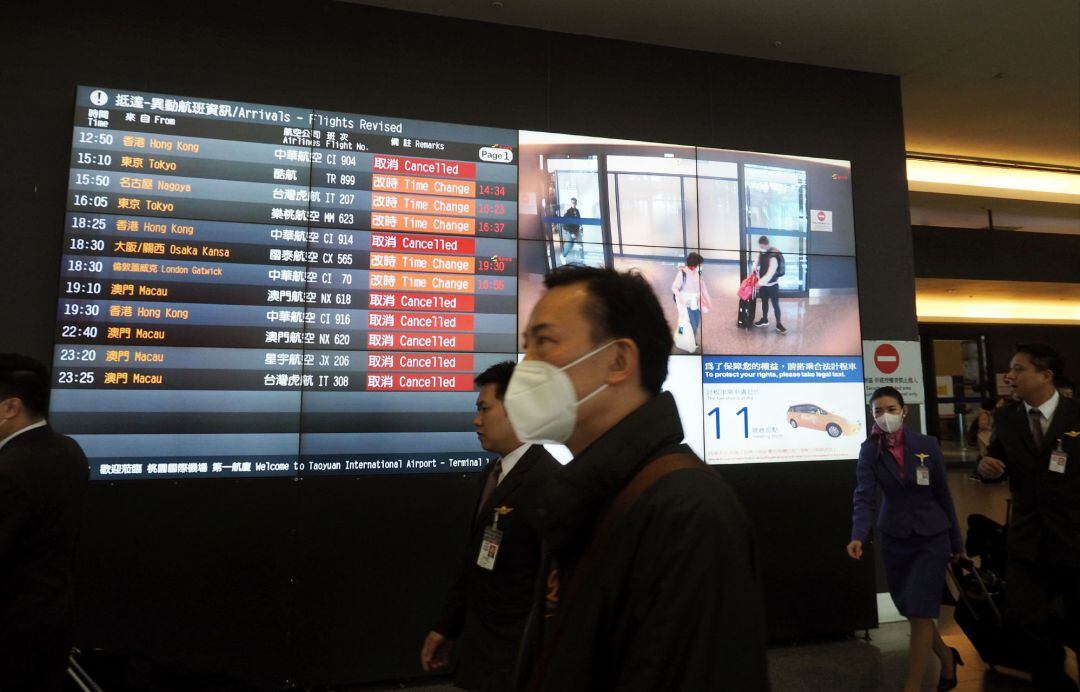 People arrive at the Taoyuan International Airport in Taoyuan City, Taiwan, 04 February 2020. On 04 February, the Foreign Ministry announced that starting 07 February, Taiwan will bar entry to foreigners who have visited China in the past 14 days as a precaution against the spread of coronavirus. 