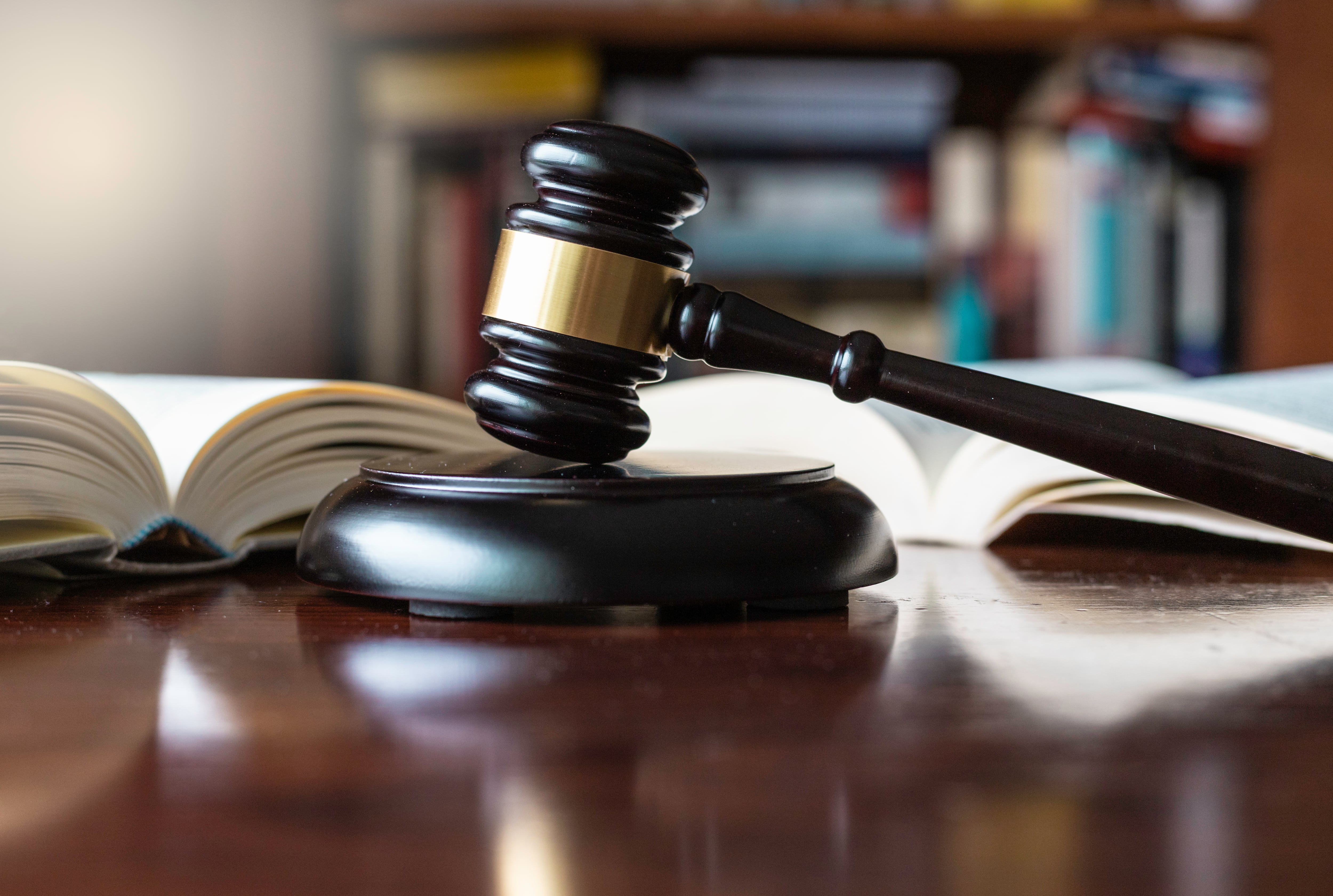 Judge&#039;s gavel and wooden block used in trials and auctions.