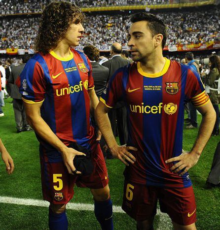 Puyol y Xavi.