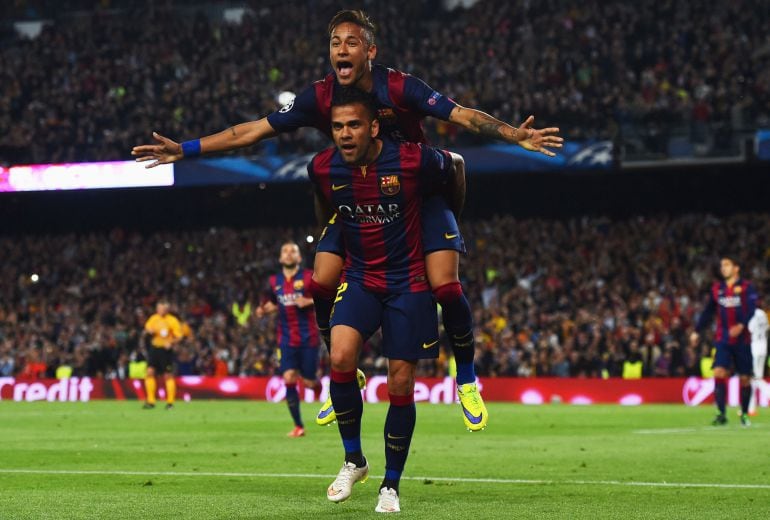 BARCELONA, SPAIN - APRIL 21:  Neymar of Barcelona celebrates with Daniel Alves (front) as he scores their second goal during the UEFA Champions League Quarter Final second leg match between FC Barcelona and Paris Saint-Germain at Camp Nou on April 21, 201