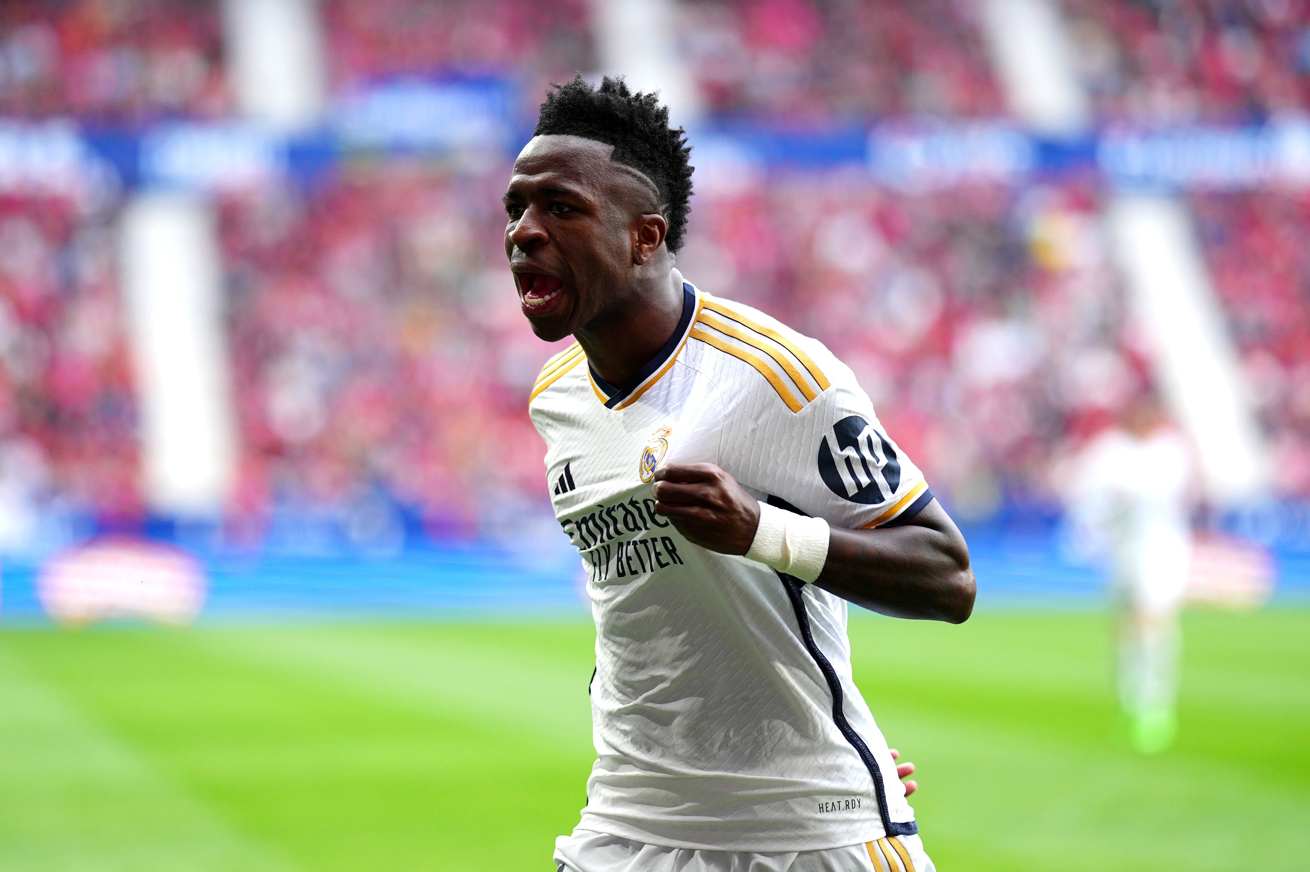 PAMPLONA, SPAIN - MARCH 16: Vinicius Junior of Real Madrid celebrates scoring his team&#039;s first goal during the LaLiga EA Sports match between CA Osasuna and Real Madrid CF at Estadio El Sadar on March 16, 2024 in Pamplona, Spain. (Photo by Juan Manuel Serrano Arce/Getty Images)