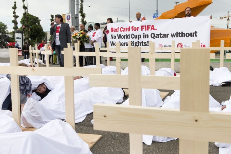 ZURICH, SWITZERLAND - MAY 29: Activists are pictured during a protest called &quot;Red Card for FIFA. No World Cup in Qatar without Workers rights!&quot; and organized by the Swiss trade union UNIA in front of the Hallenstadion in Zurich during the 65th FIFA Congre