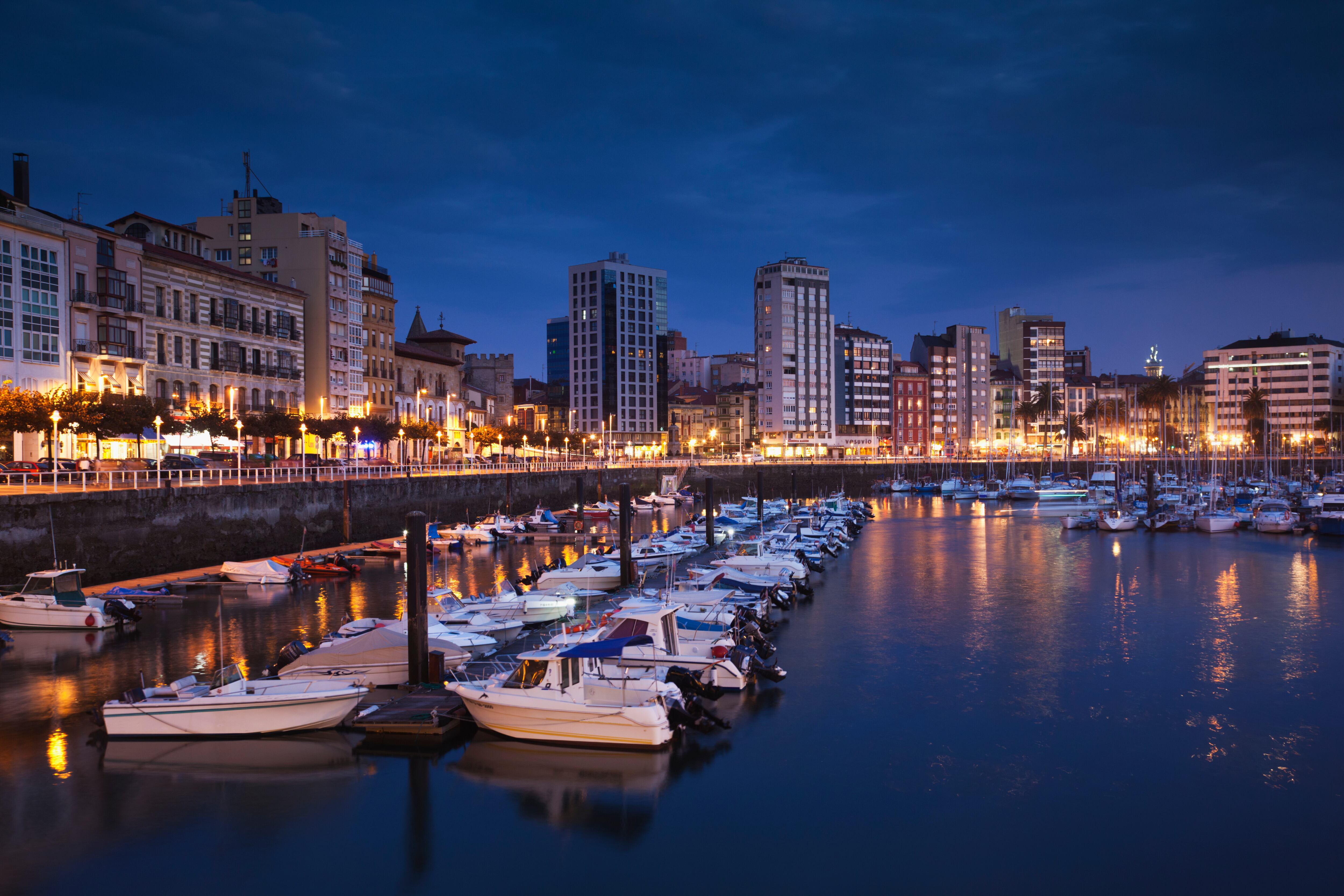 Spain, Asturias Region, Asturias Province, Gijon, Cimadevilla Old Town, harborfront buildings along the Puerto Deportivo port, evening