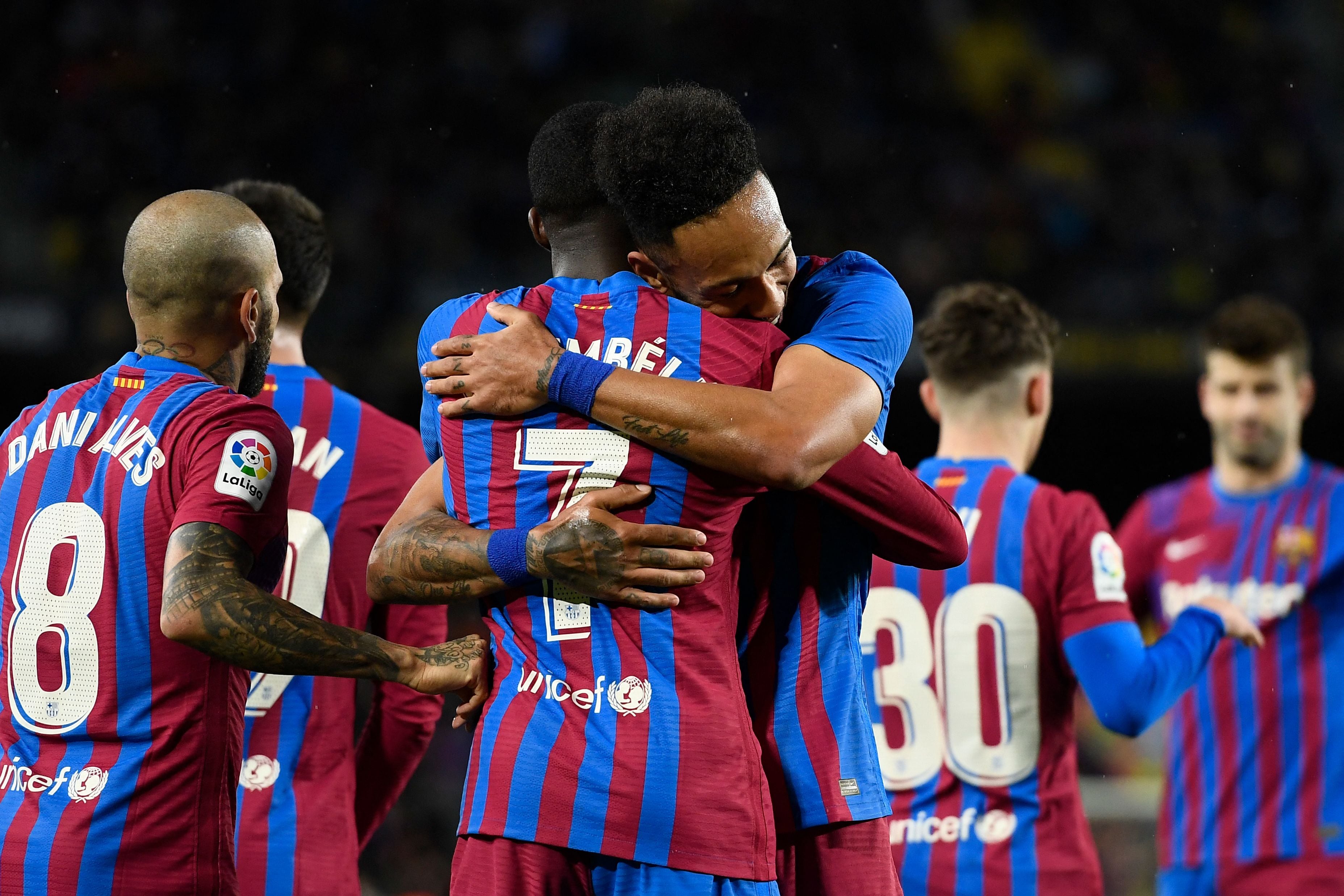 Barcelona&#039;s Gabonese midfielder Pierre-Emerick Aubameyang (R) celebrates with teammate Barcelona&#039;s French forward Ousmane Dembele after scoring a goal during the Spanish league football match between FC Barcelona and CA Osasuna at the Camp Nou stadium in Barcelona on March 13, 2022. (Photo by Josep LAGO / AFP) (Photo by JOSEP LAGO/AFP via Getty Images)