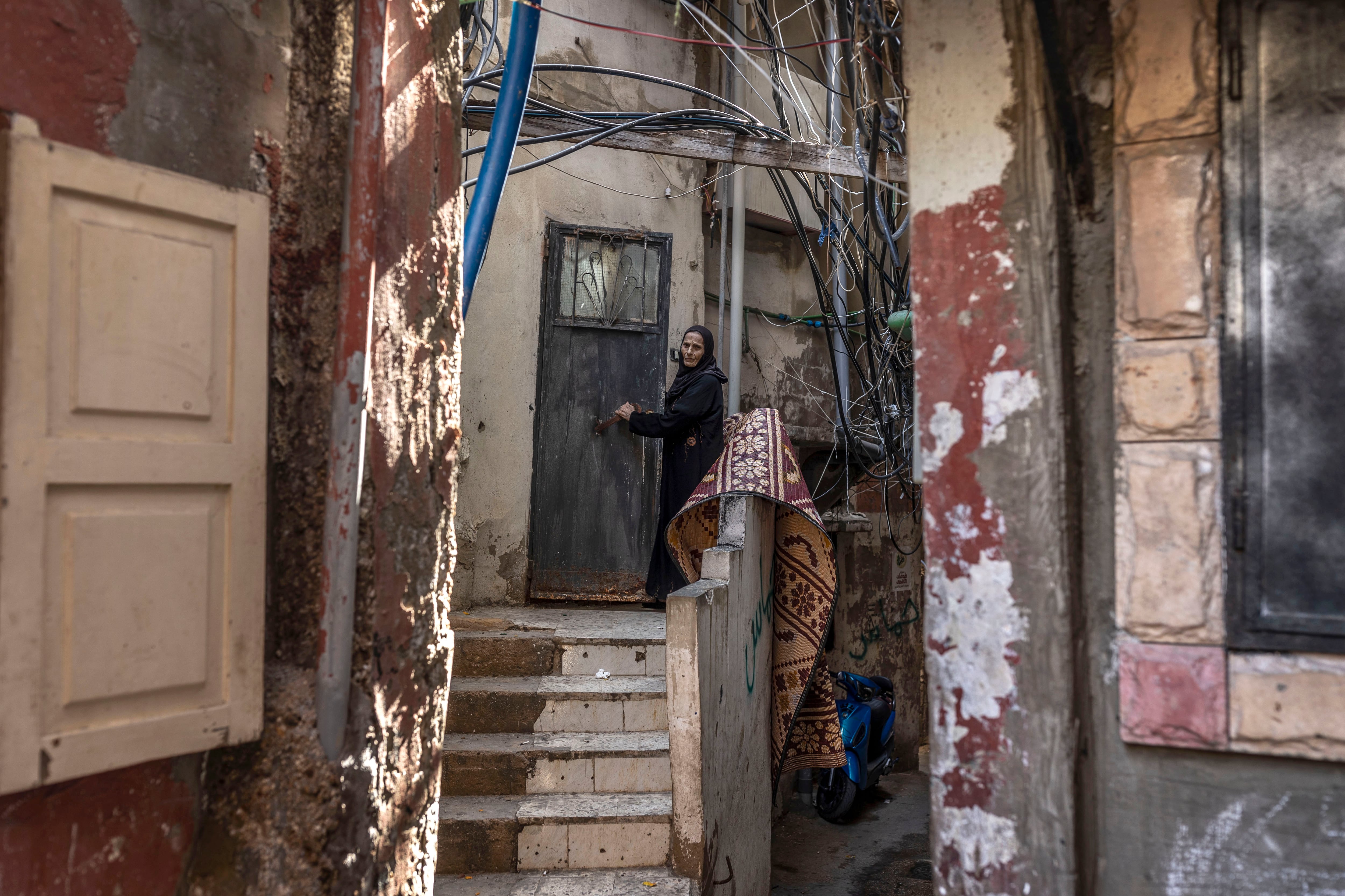 BEIRUT, LEBANON - OCTOBER 26: An elderly Palestinian refugee at the door of her house within the Burj al-Barajneh Palestinian refugee camp on October 26, 2023 in Beirut, Lebanon. Burj al-Barajneh camp was established in 1948 during the Arab-Israeli war, and is home to some 20, 000 refugees. Security and governance in the camp are the responsibility of Popular Committees and Palestinian factions. (Photo by Manu Brabo/Getty Images)