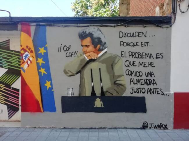 Grafiti del momento en el que el director del Centro de Coordinación de Emergencias de Sanidad, Fernando Simón, tose por 'comerse una almendra', en la calle Juan Giner de Benimaclet (València), firmado por @j.warx en Instagram