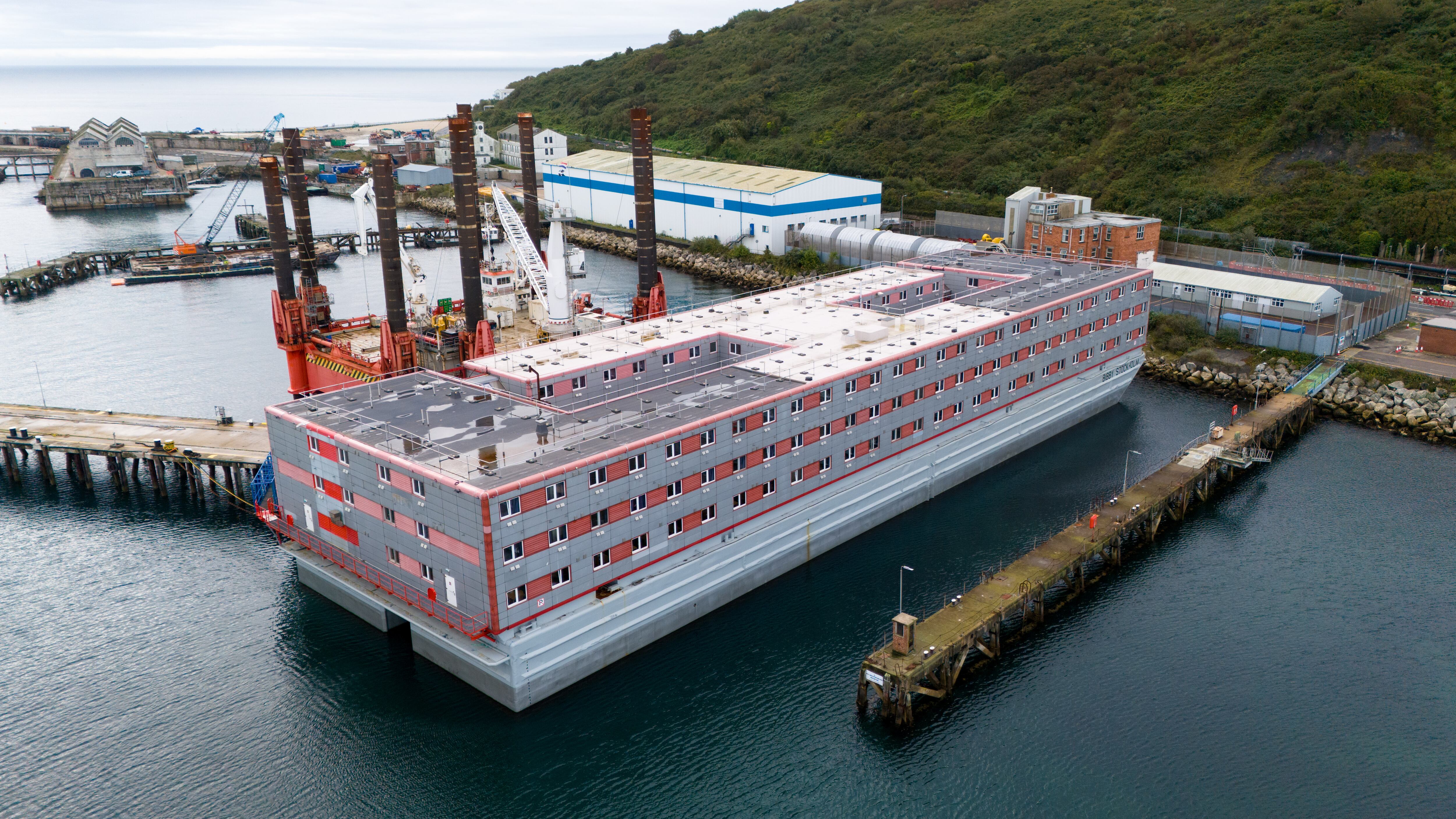 PORTLAND, ENGLAND - OCTOBER 12: An aerial view of the Bibby Stockholm immigration barge in Portland Port, on October 12, 2023 in Portland, United Kingdom. The Home Office plans to return asylum seekers to the Bibby Stockholm barge next week following a lengthy evacuation after legionella was found on board. (Photo by Finnbarr Webster/Getty Images)