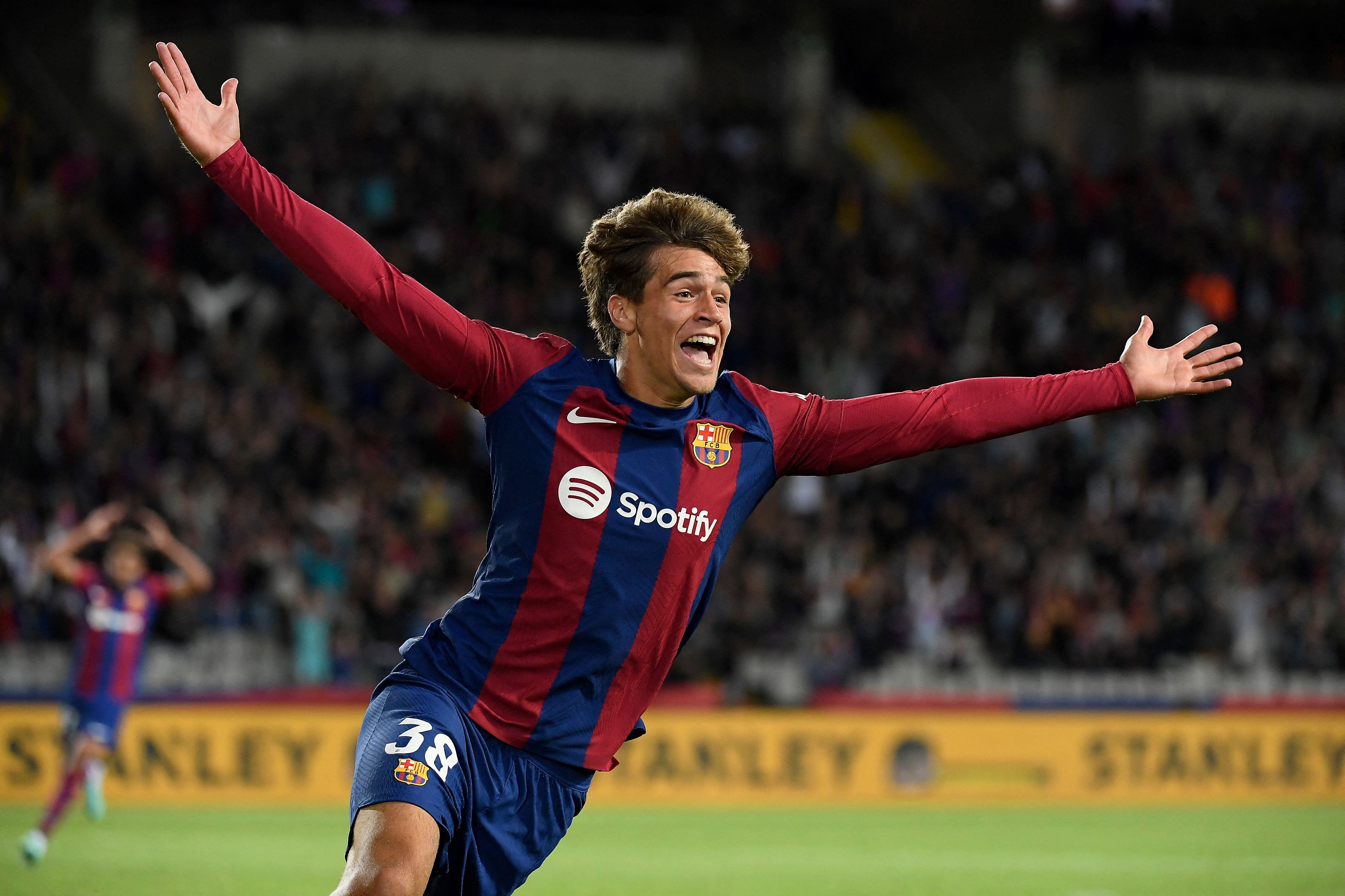 Barcelona&#039;s Spanish forward #38 Marc Guiu celebrates after scoring his team&#039;s first goal during the Spanish league football match between FC Barcelona and Athletic Club Bilbao at the Estadi Olimpic Lluis Companys in Barcelona on October 22, 2023. (Photo by Josep LAGO / AFP) (Photo by JOSEP LAGO/AFP via Getty Images)