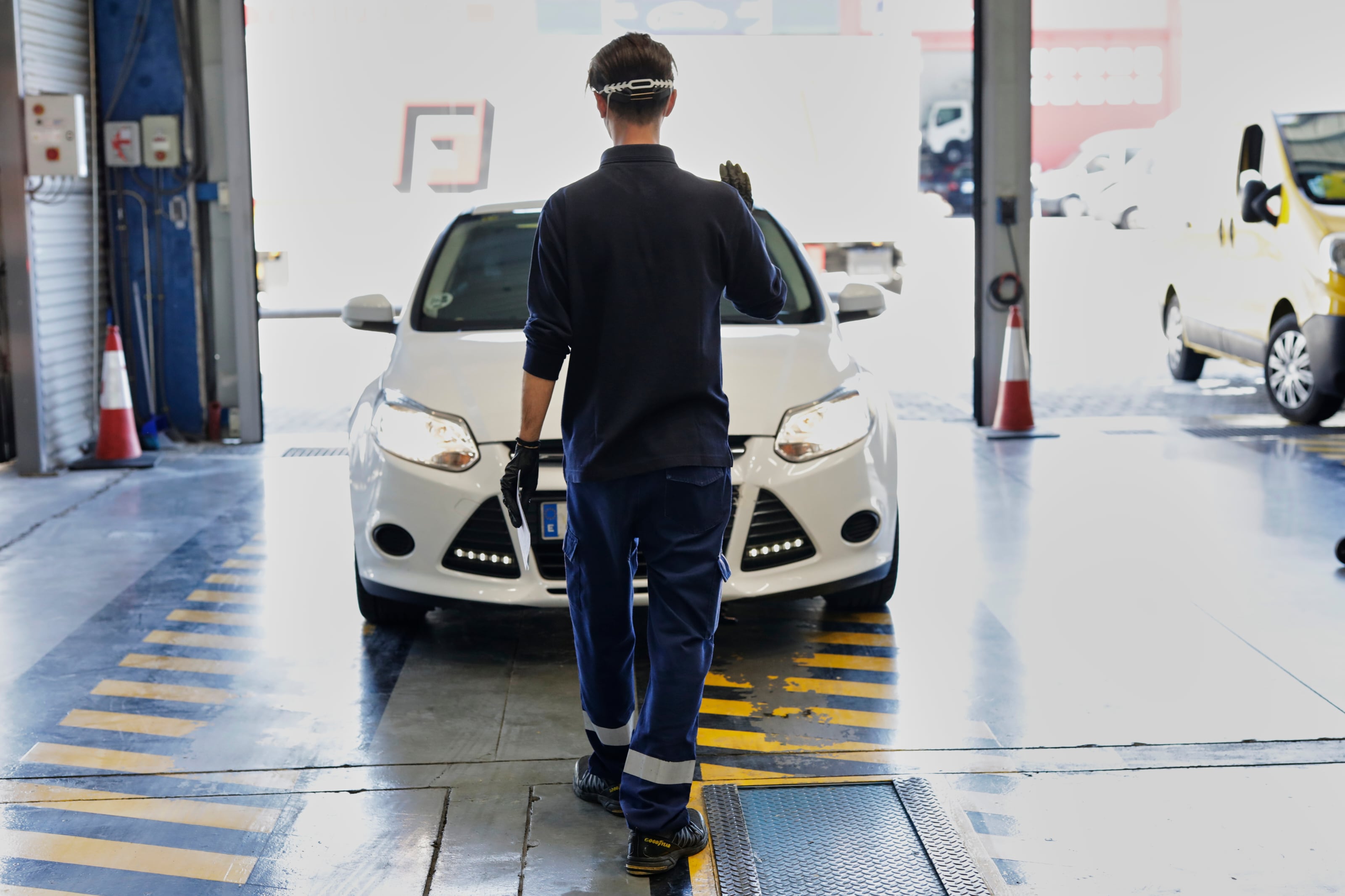 MADRID, SPAIN - MAY 18: A worker checks a car on the ITV from the Villaverde to Vallecas highway, in the Transportation Center, once the ITV stations open their doors during phase 0 of the reduction of confinement to check the vehicles of all those drivers who have requested previous appointment on May 18, 2020 in Madrid, Spain. (Photo by Jesús Hellín/Europa Press via Getty Images)