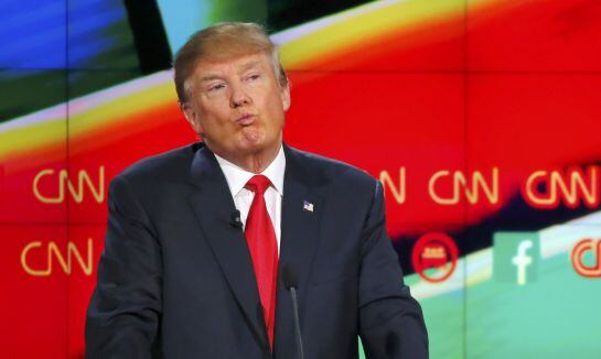 Republican U.S. presidential candidate businessman Donald Trump reacts during the Republican presidential debate in Las Vegas, Nevada December 15, 2015. REUTERS/Mike Blake