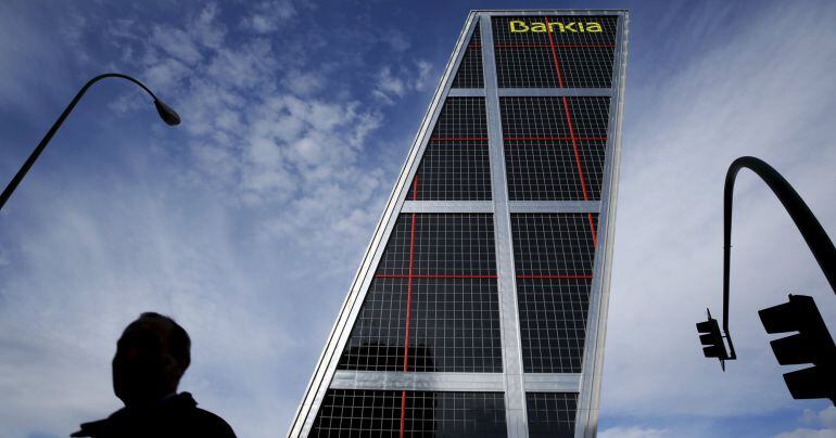 A man walks near the headquarters of Spanish nationalised lender Bankia in Madrid