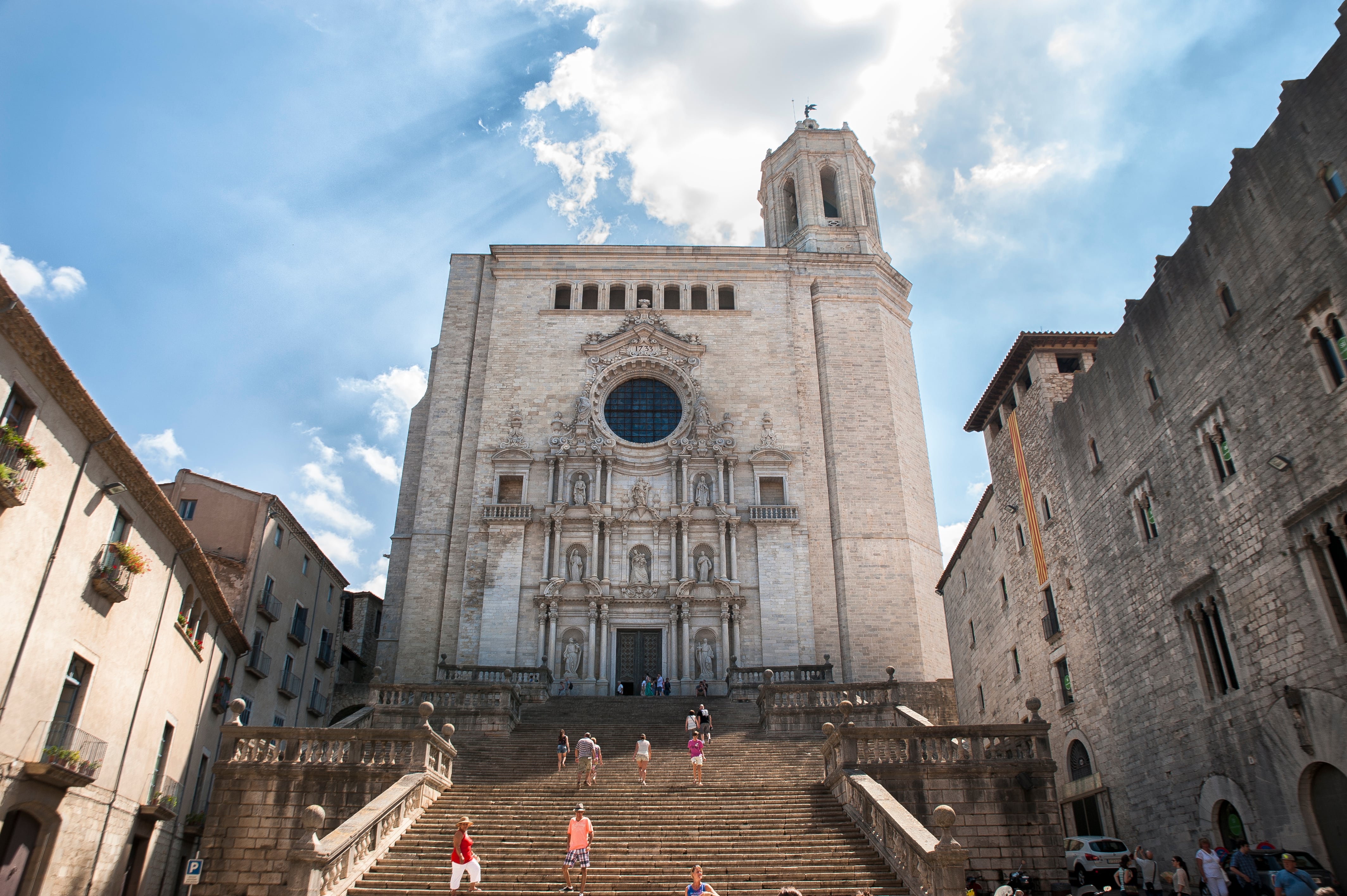 Cathedral of Girona, Spain. Backlighting. Main facade with staircase and buildings on either side.