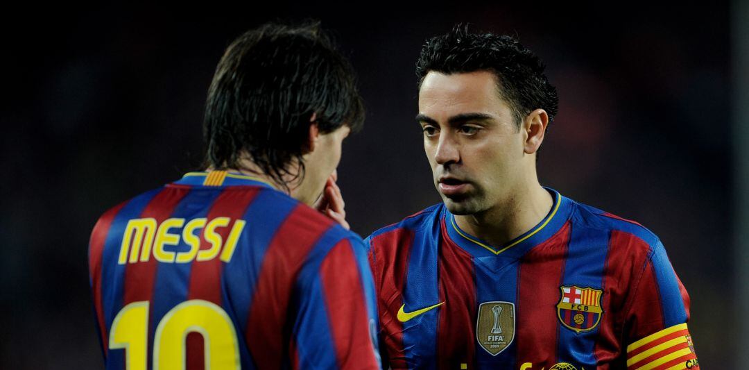 Messi y Xavi, durante un partido de Champions del Barcelona del año 2010