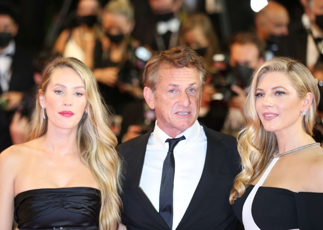 10 July 2021, France, Cannes: (L-R) US model Dylan Frances Penn, his father US actor Sean Penn and Canadian actress Katheryn Winnick arrive to attend the screening of &#039;Flag Day&#039; by Sean Penn during the 74th annual Cannes Film Festival