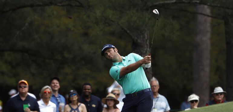 Jon Rahm of Spain chips to the 8th green during second round play of the 2018 Masters golf tournament at the Augusta National Golf Club in Augusta, Georgia, U.S., April 6, 2018