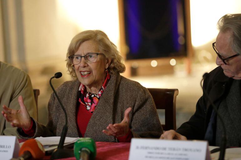 Manuela Carmena durante la firma de un convenio en la ermita de San Antonio de la Florida