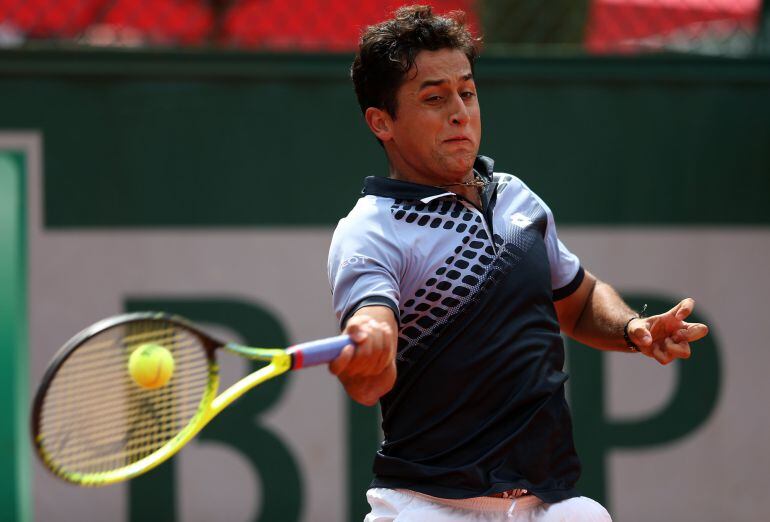 PARIS, FRANCE - MAY 26:  Nicolas Almagro of Spain plays a forehand in his Men&#039;s Singles match against  Alexandr Dolgopolov of Ukraine on day three of the 2015 French Open at Roland Garros on May 26, 2015 in Paris, France.  (Photo by Clive Mason/Getty Images)