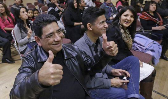 Serafin Bahena gives a thumbs-up before the start of President Barack Obama nationally televised address at Centro Civico Mexicano, Thursday, Nov. 20, 2014, in Salt Lake City. (AP Photo/Rick Bowmer) 