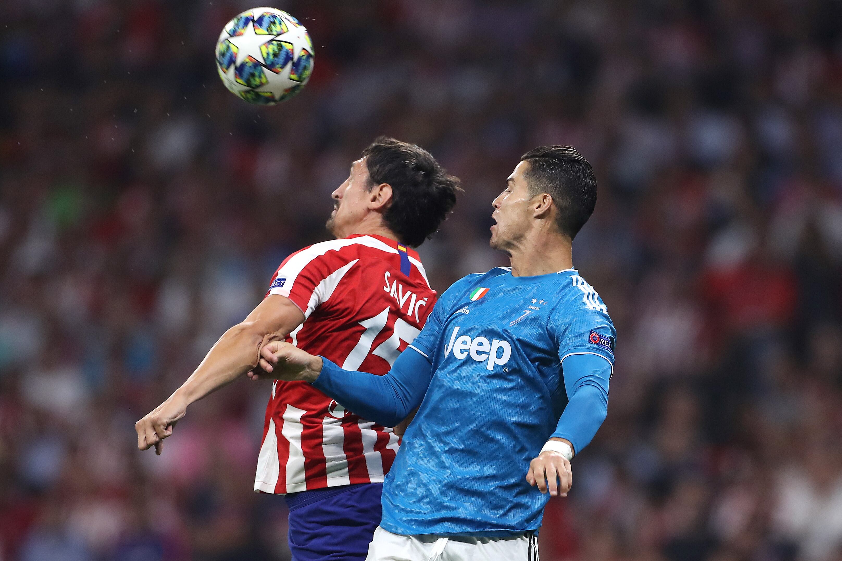 Savic y Cristiano Ronaldo durante un Atleti - Juvenuts