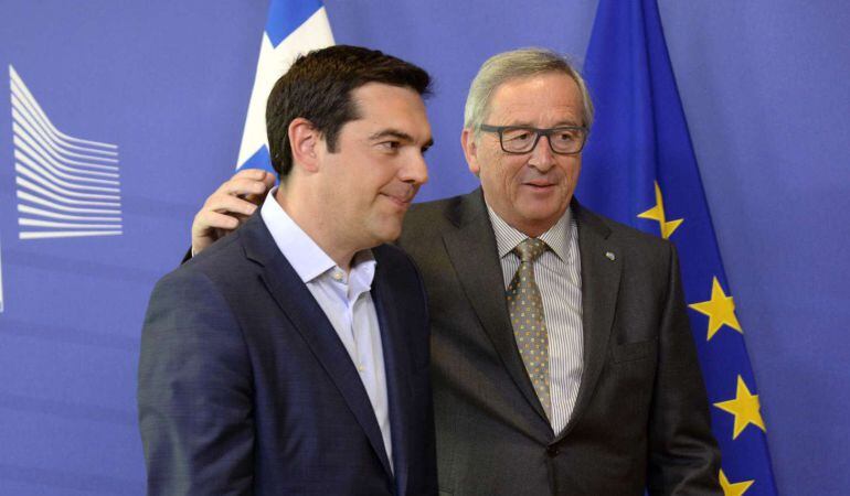 Prime Minister of Greece Alexis Tsipras (L) walks with European Union Commission President Jean-Claude Juncker prior to their meeting at the European Union Commission headquarter in Brussels, on June 3, 2015. Greek Prime Minister Alexis Tsipras heads for 