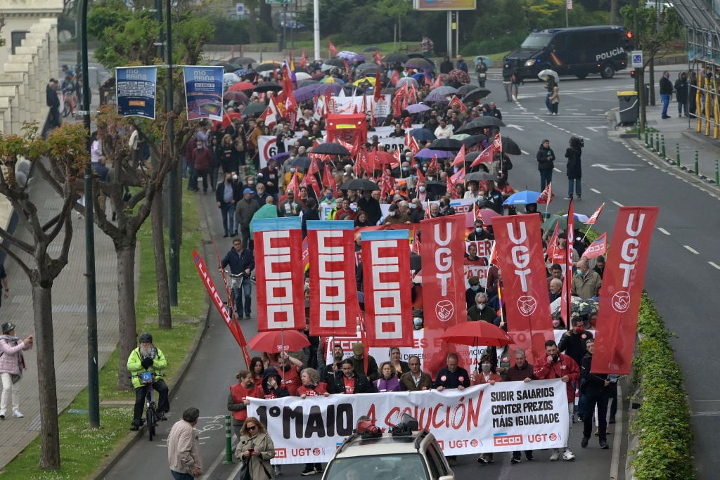 LA CORUÑA, GALICIA, SPAIN - MAY 01: Hundreds of people march, during the demonstration for the International Workers' Day or May Day, from the Government Delegation, May 1, 2022, in A Coruña, Galicia, Spain. Under the slogan 'The solution: raise wages, contain prices, more equality', the trade unions CC.OO. and UGT have marched through the streets of the main Galician towns, supported by PSOE and Podemos. (Photo By M. Dylan/Europa Press via Getty Images)