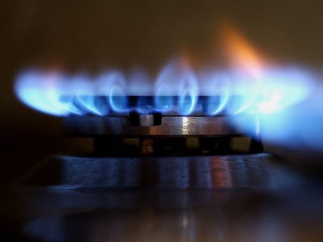 Gas And Oil Concept. Energy Crisis. Blue Flame Of Gas Stove Top