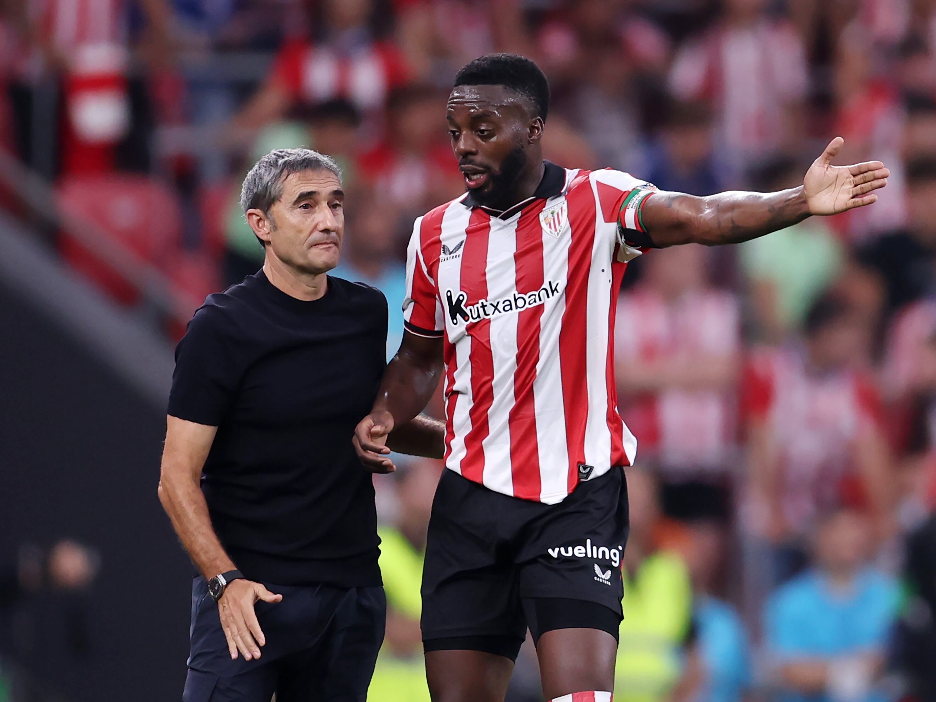 BILBAO, SPAIN - AUGUST 17: Inaki Williams of Athletic Club interacts with Ernesto Valverde, Head Coach of Athletic Club, during the LaLiga EA Sports match between Athletic Club and Sevilla FC at Estadio de San Mames on August 17, 2025 in Bilbao, Spain. (Photo by Ion Alcoba Beitia/Getty Images)