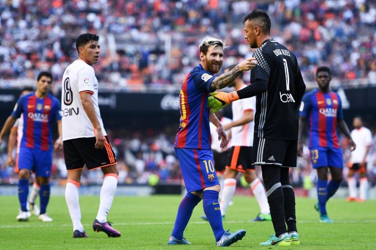 Lionel Messi of FC Barcelona celebrates towards a TV camera after scoring his team&#039;s third from the penalty spot goal during the La Liga match between Valencia CF and FC Barcelona at Mestalla stadium on October 22, 2016 in Valencia, Spain.  (Photo by Davi