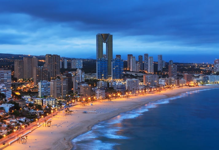 Benidorm is a town on the Costa Blanca in Spain, northeast of Alicante in the province of Alicante in the Valencian Community, Spain. Once a small village for fishing, today it is for mass tourism with many tall hotels and appartment buildings.