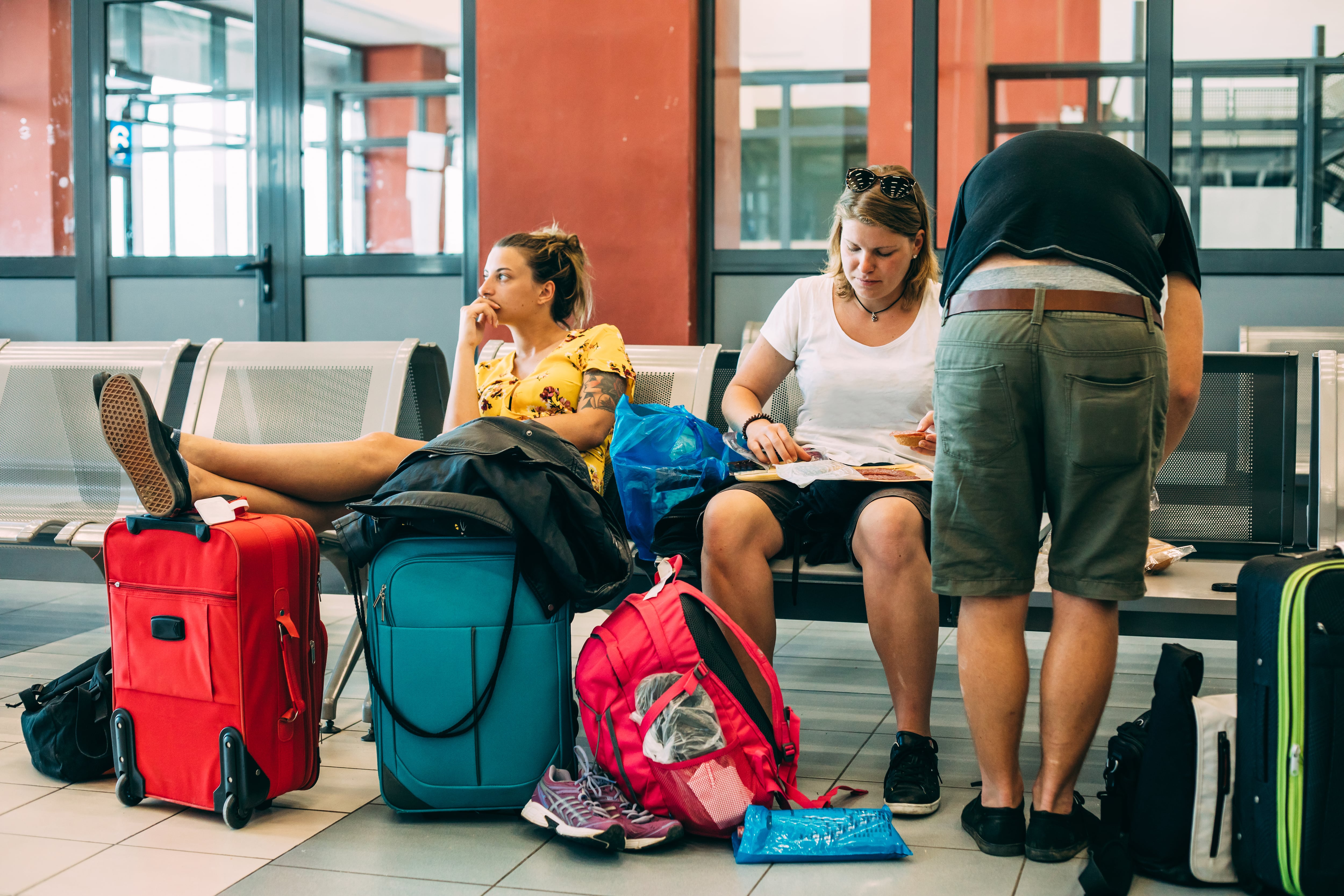 Group of Friends Waiting at Airport Waitroom.