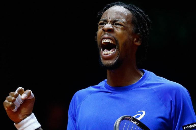 LILLE, FRANCE - NOVEMBER 21:  Gael Monfils of France celebrates winning a game against Roger Federer of Switzerland during day one of the Davis Cup Tennis Final between France and Switzerland at the Stade Pierre Mauroy on November 21, 2014 in Lille, Franc