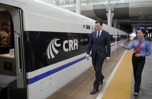 Britain&#039;s Chancellor of the Exchequer George Osborne (L) walks towards a Chinese high-speed built train as he visits the Chengdu East Railway Station in Chengdu, Sichuan province, China, September 24, 2015. REUTERS/China Daily CHINA OUT. NO COMMERCIAL OR 