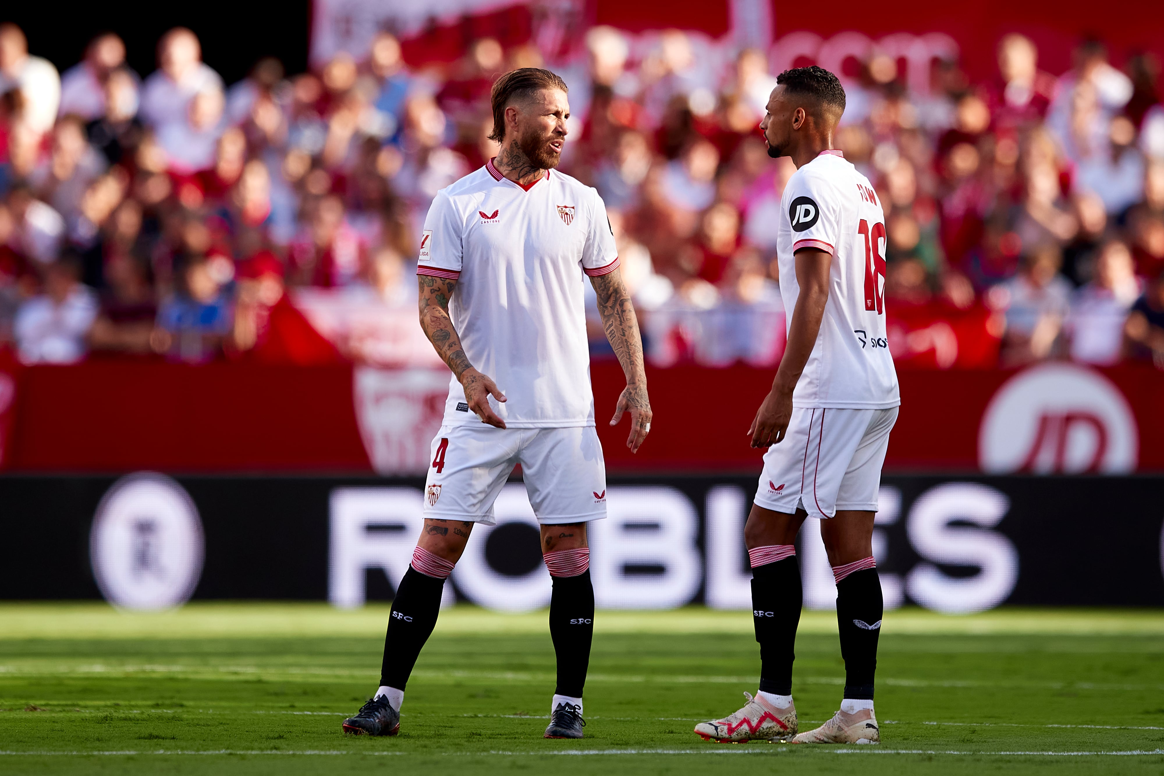 SEVILLE, SPAIN - SEPTEMBER 17: Sergio Ramos speaks with Djibril Sow of Sevilla FC during during the LaLiga EA Sports match between Sevilla FC and UD Las Palmas at Estadio Ramon Sanchez Pizjuan on September 17, 2023 in Seville, Spain. (Photo by Fran Santiago/Getty Images)